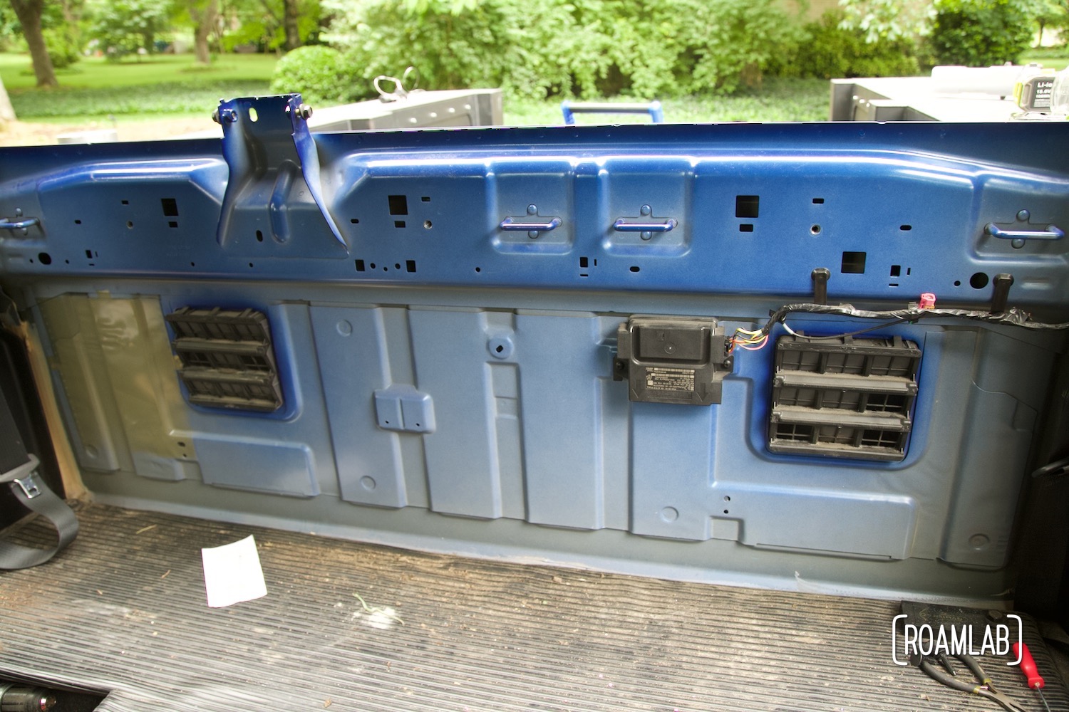 Truck cab rear interior all with paneling removed.