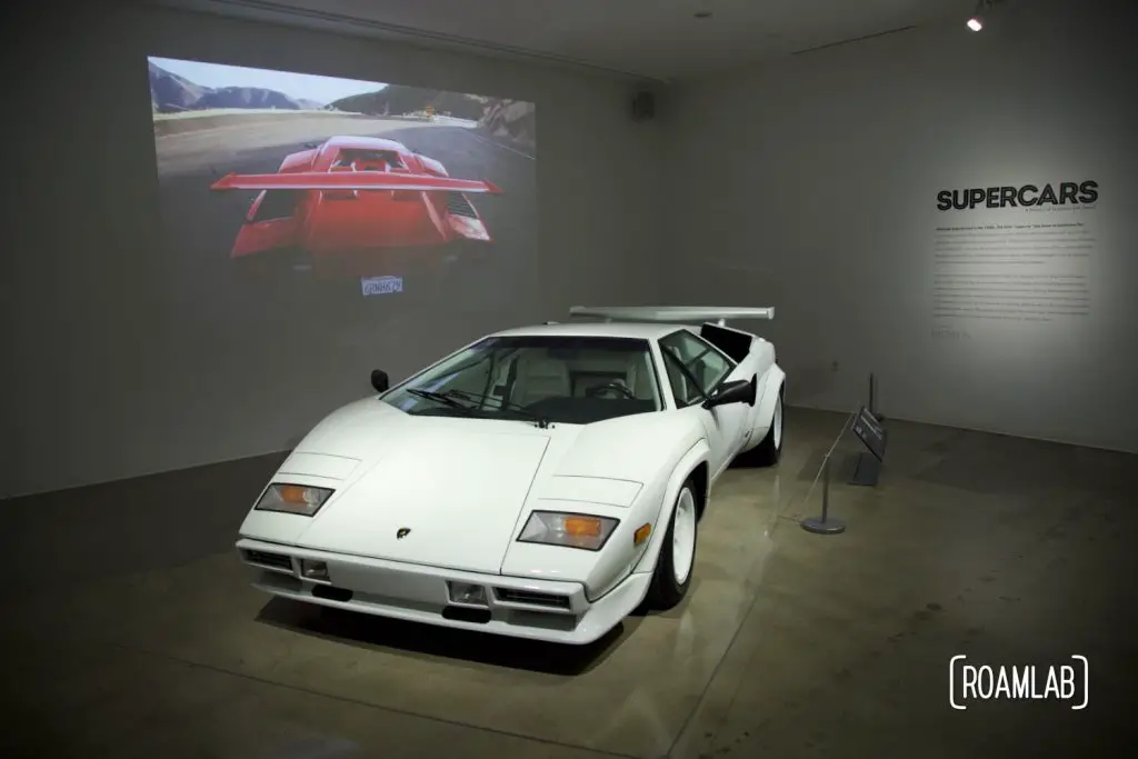 A white 1985 Lamborghini Countach LP 500S in the Supercars exhibit at the Petersen Automotive Museum.