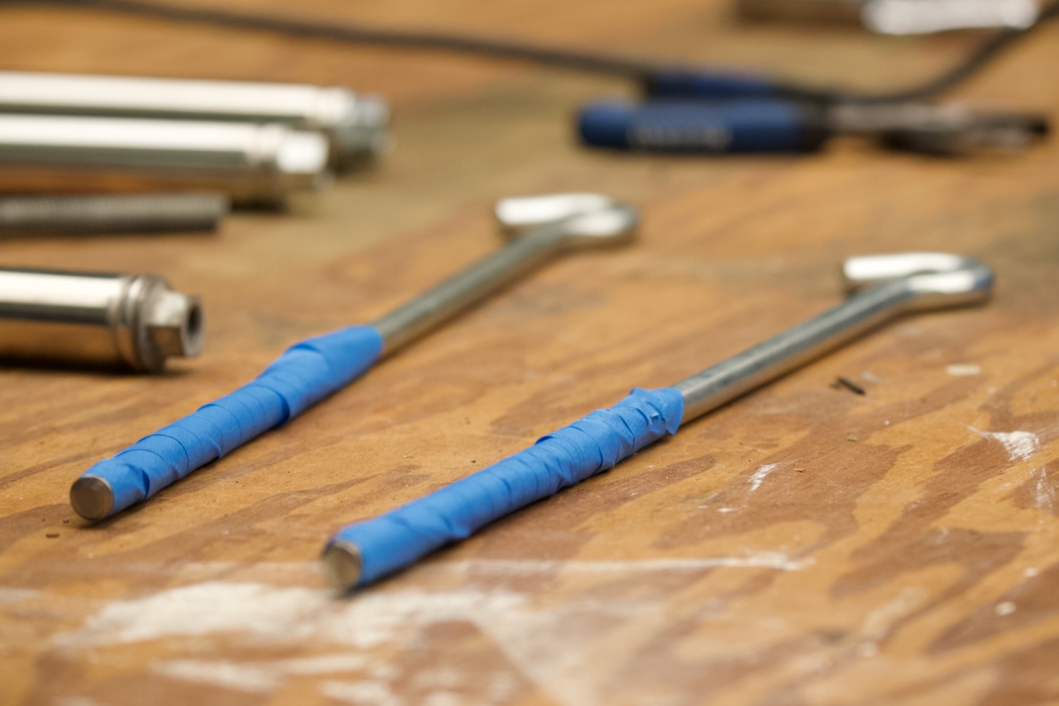 Threads of an I-bolt wrapped in masking tape.