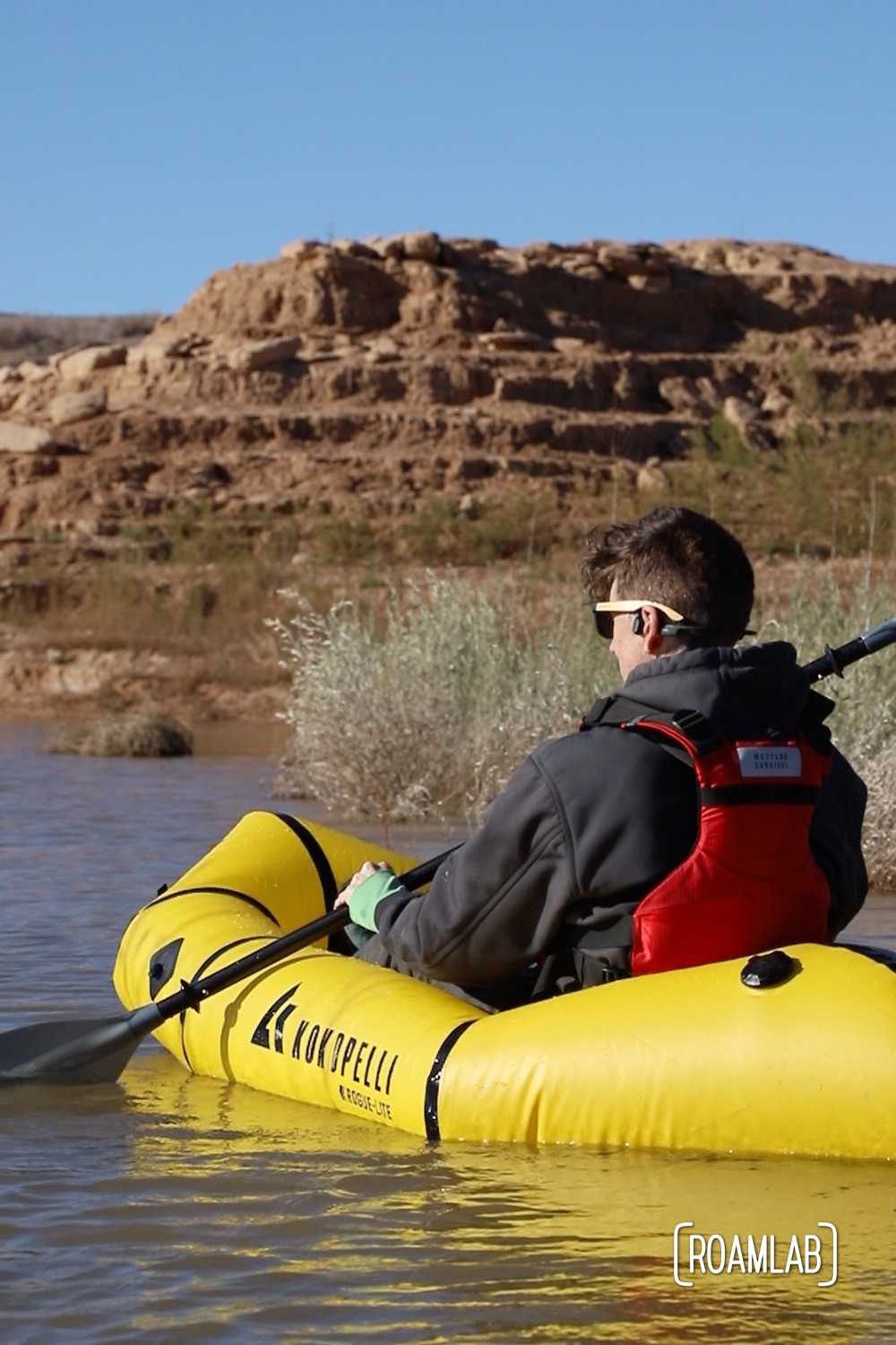 Man paddling in a yellow raft on Lake Mead.