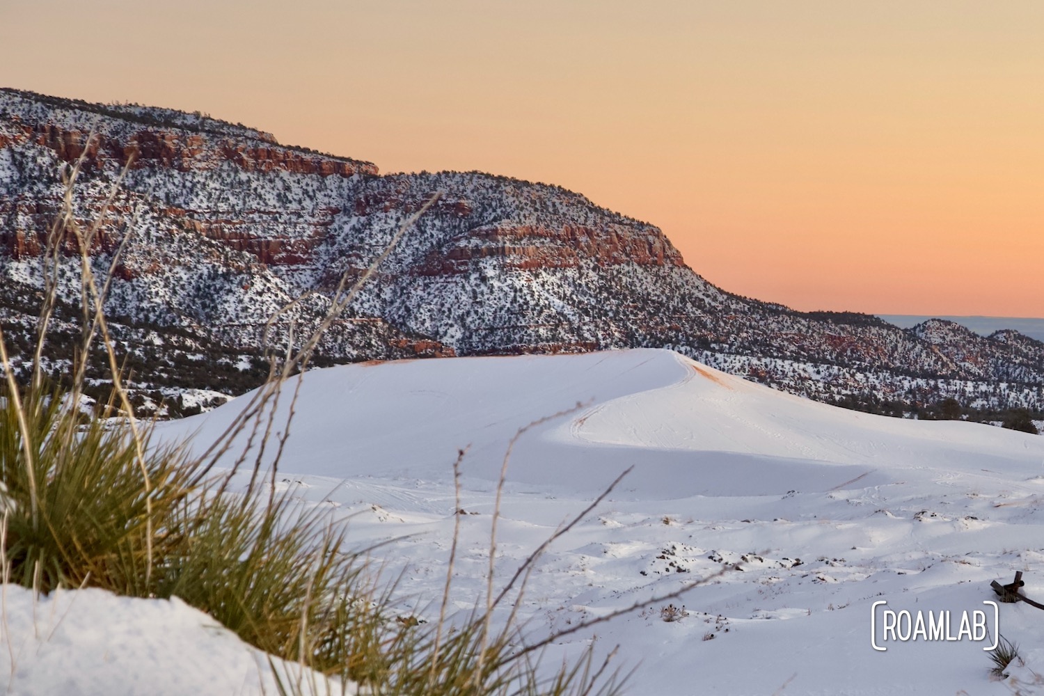 Sunset over the snow covered dunes of Coral Pink Sand Dunes State Park in Northern Arizona.