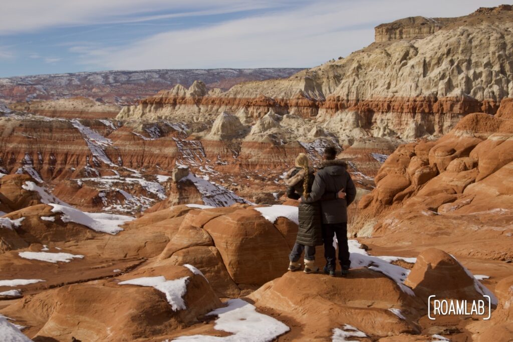 Couple standing at the edge of the Paria River Valley from Toadstool Hoodoo Trail.