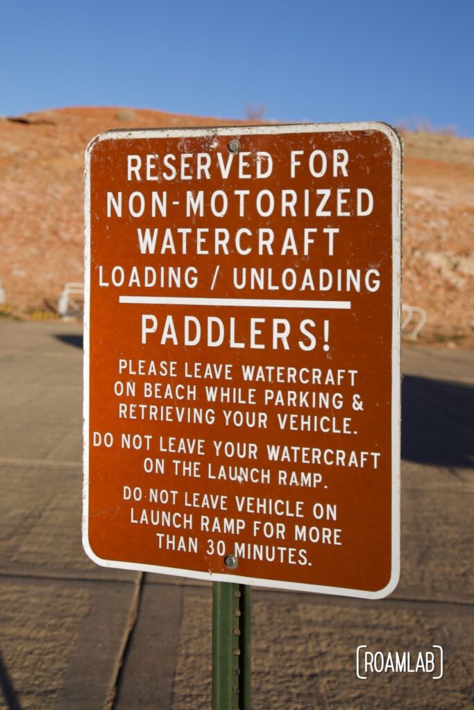 Sign at the end of the boat launch reserving parking for loading and unloading small watercraft.