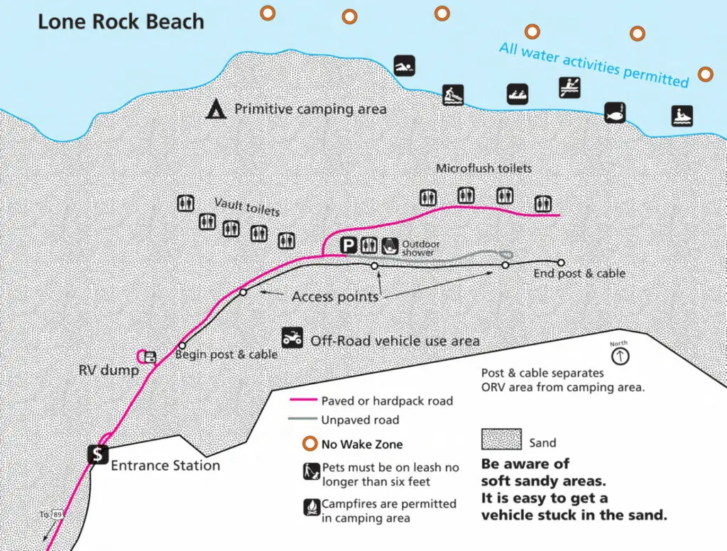Map of Lone Rock Breach with paved and unpaved roads, bathrooms, and and camping.