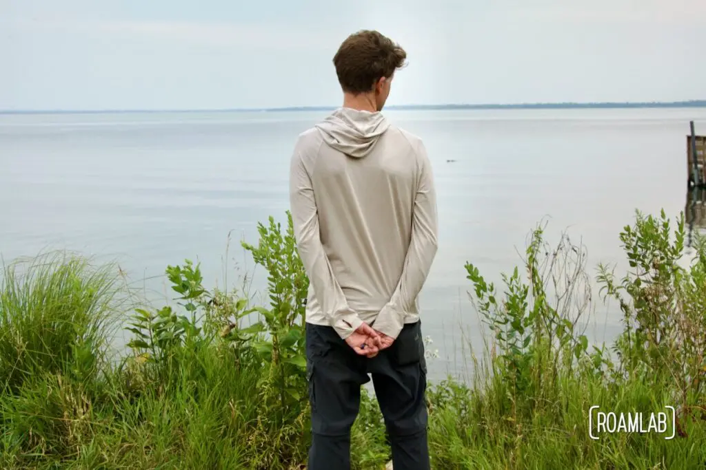 Man looking out over a lake.