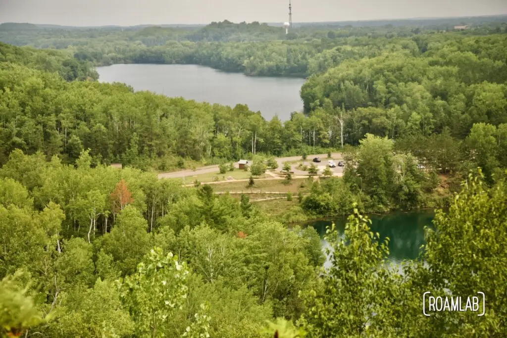 Overview of parking lot for Miners Mountain Rally Center and a lake in the background.