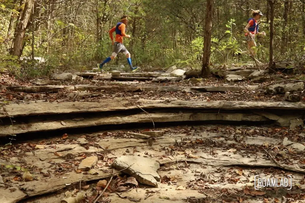 Man running along a rocky outcropping