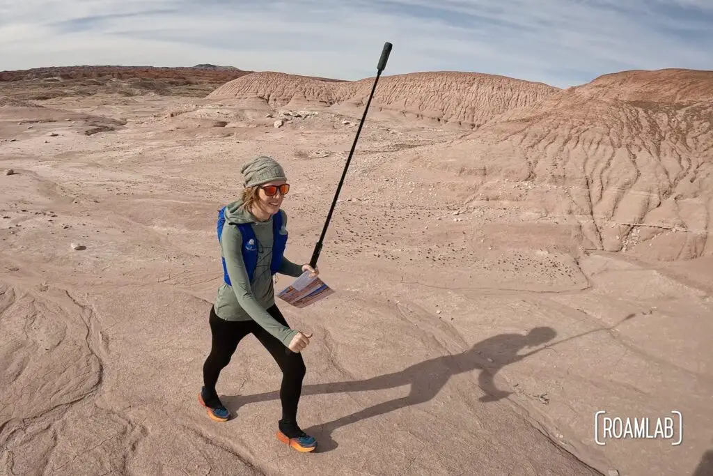 Woman running with a 360 camera.