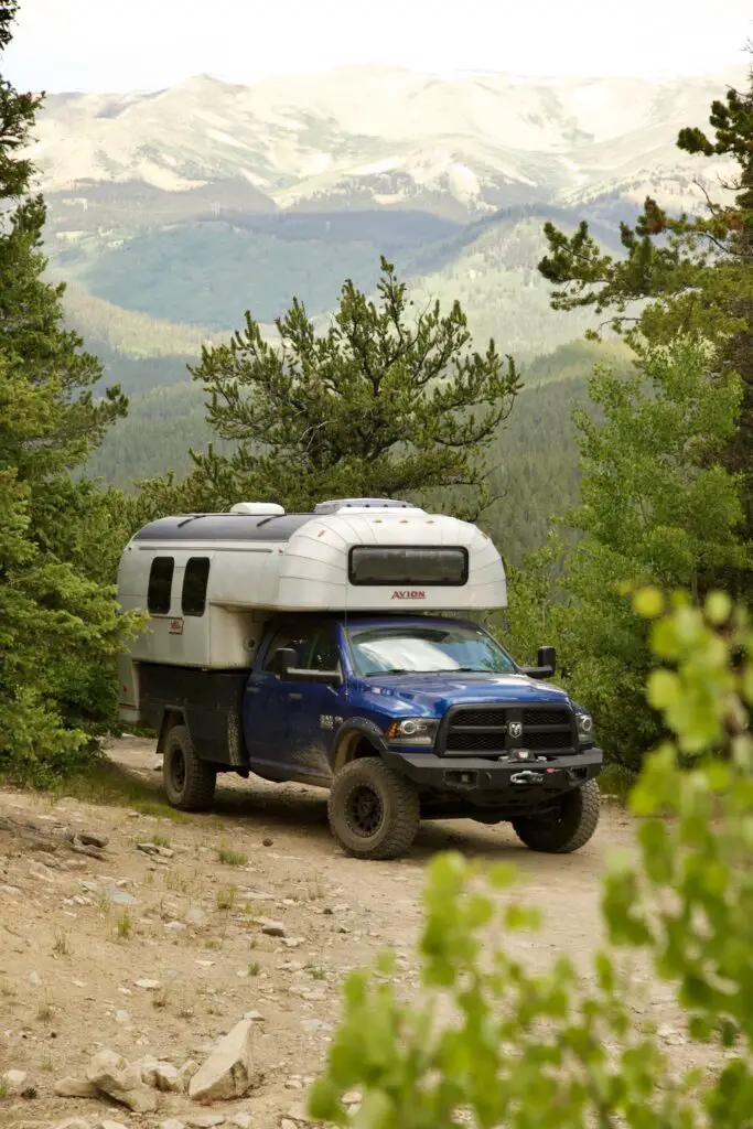 1970 Avion C11 truck camper parked among the mountains outside of Como, Colorado