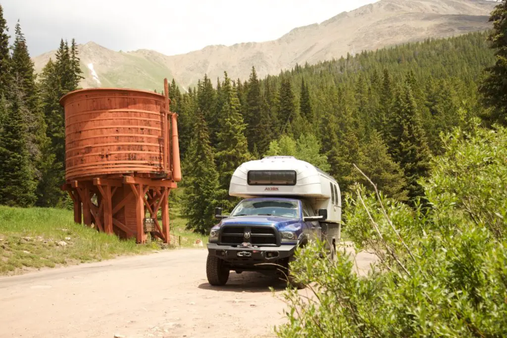 1970 Avion C11 truck camper parked by Backer's Tank on Boreas Road between Como and Breckenridge, Colorado.