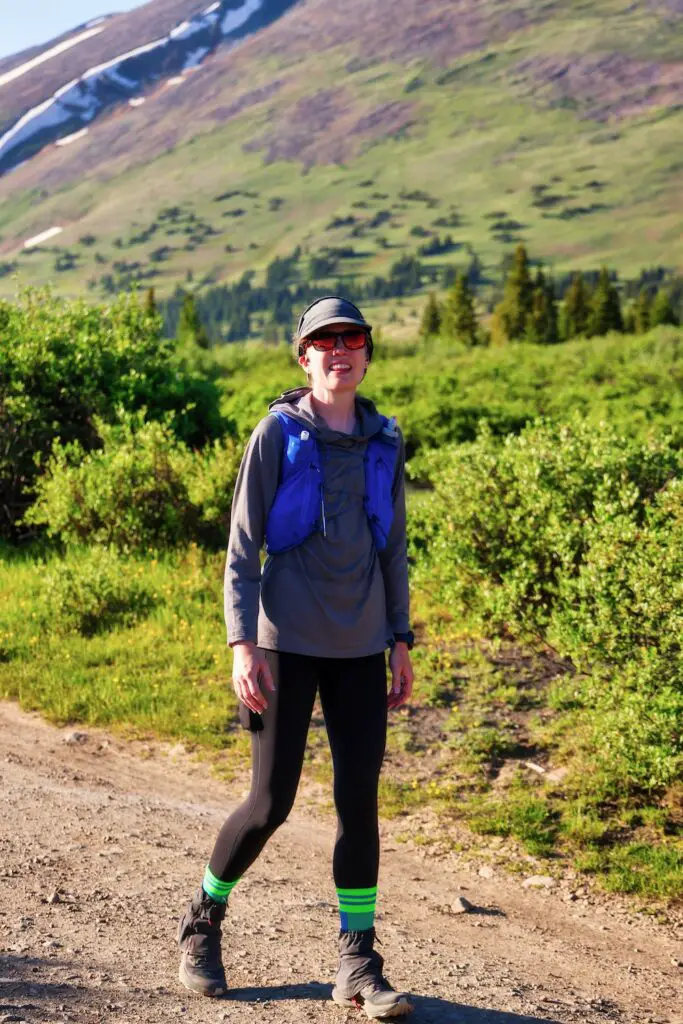 Woman walking along Boreas Road in the Silverheels 100k