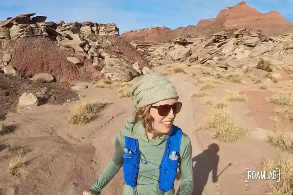 Woman running through the red desert of Wilderness Loop in Petrified Forest National Park